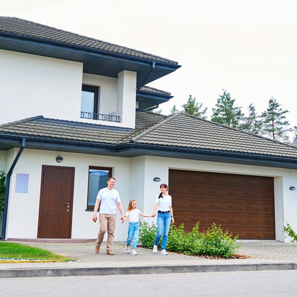 family going from new modern townhouse outdoors family going from new modern townhouse outdoors